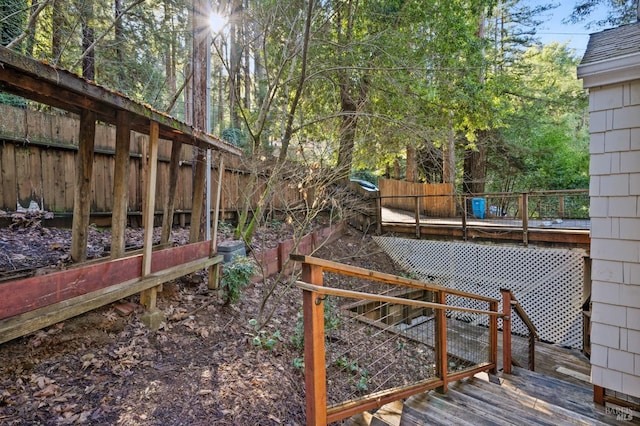 view of yard featuring a wooden deck