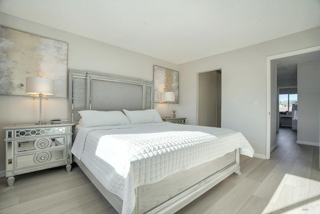 bedroom with light hardwood / wood-style floors