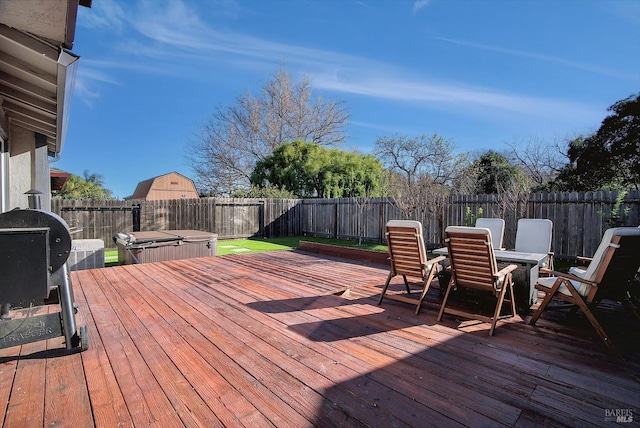 deck with a hot tub