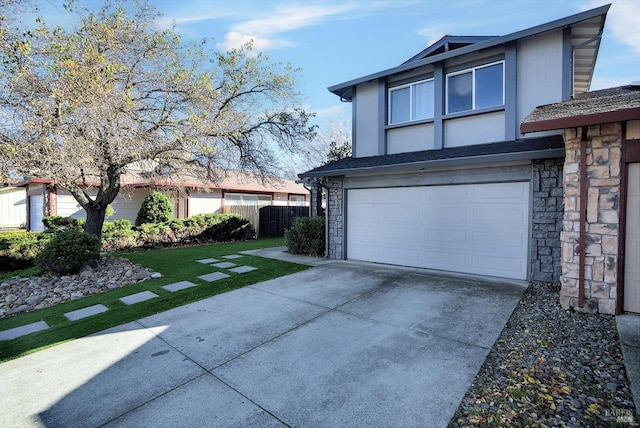 view of property exterior featuring a garage and a lawn