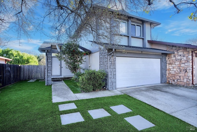 view of front facade featuring a garage and a front lawn