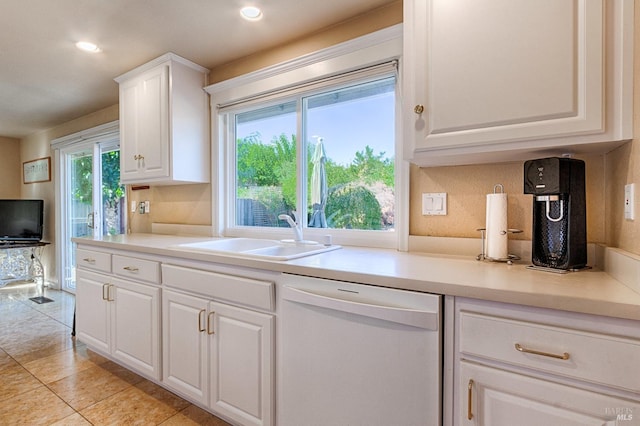 kitchen featuring recessed lighting, a sink, white cabinets, light countertops, and dishwasher