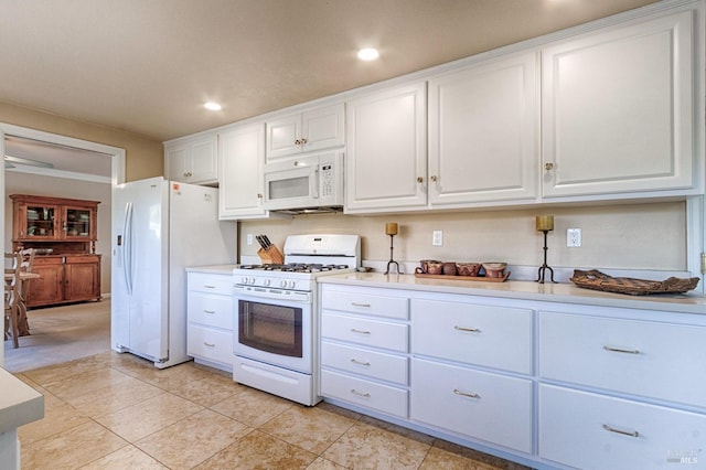 kitchen featuring white cabinets, white appliances, light countertops, and recessed lighting