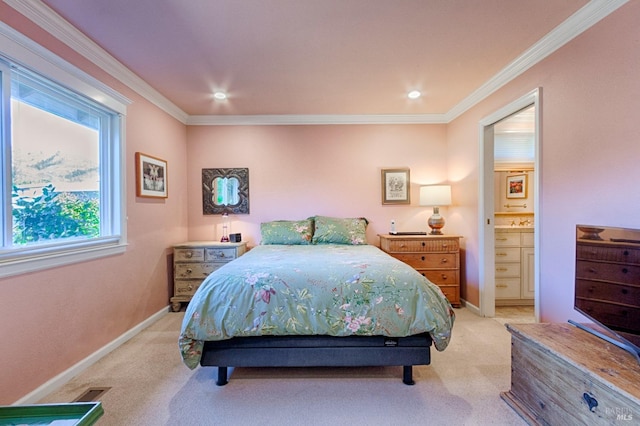 bedroom with light carpet, connected bathroom, baseboards, and crown molding