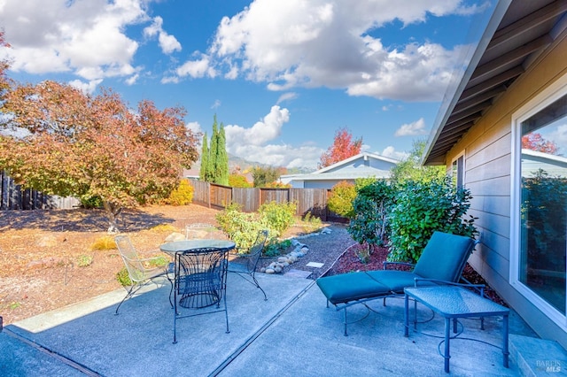 view of patio / terrace with outdoor dining area and a fenced backyard