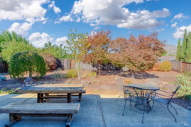 view of patio / terrace with outdoor dining space and a fenced backyard