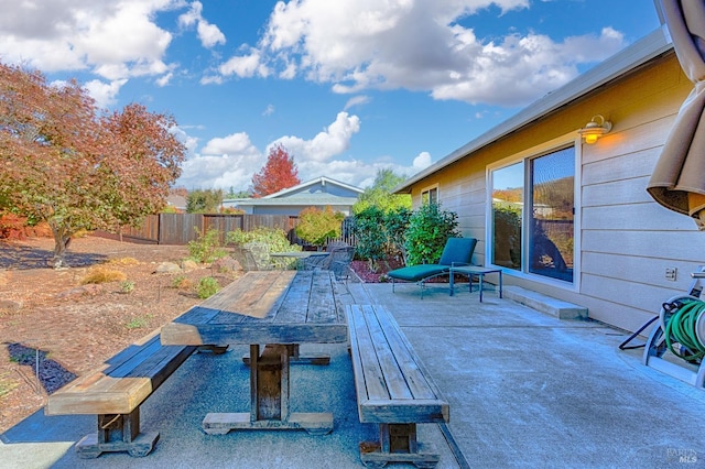 view of patio / terrace featuring outdoor dining space and a fenced backyard