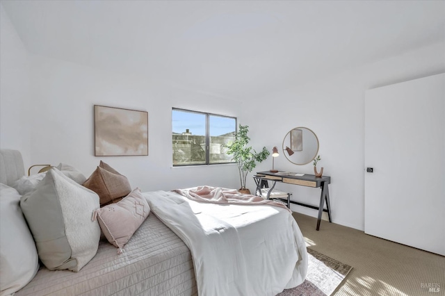 bedroom with light carpet