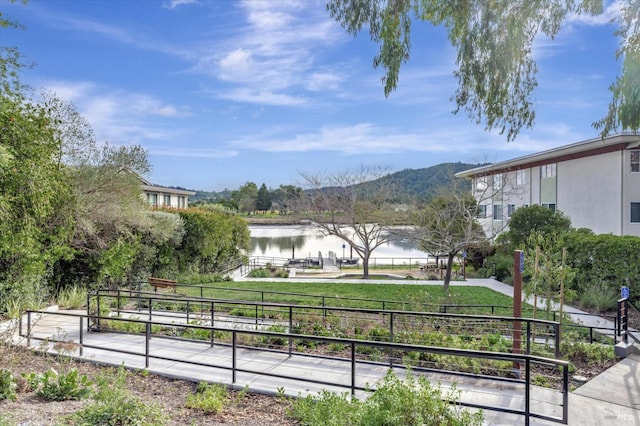 view of home's community featuring a water and mountain view