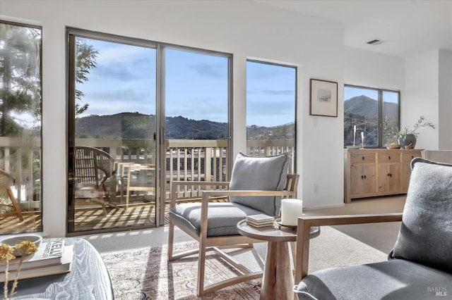 sunroom featuring a mountain view