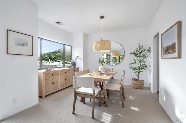 view of carpeted dining space