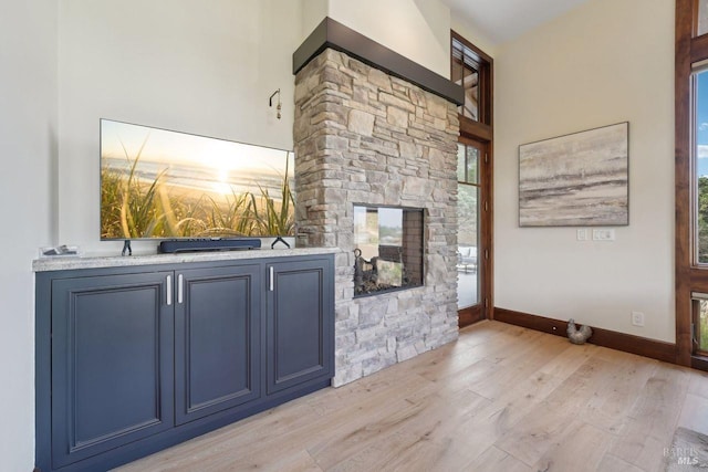 bar with baseboards and light wood-style floors