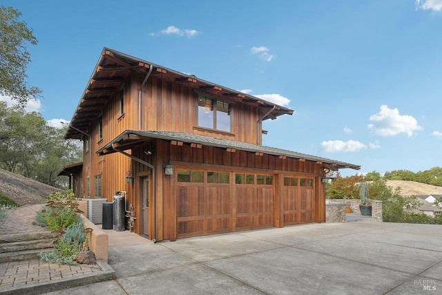 exterior space featuring driveway and an attached garage