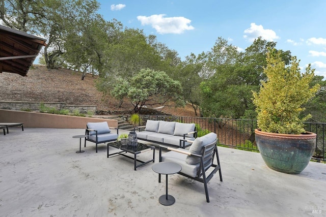 view of patio / terrace featuring fence and an outdoor living space