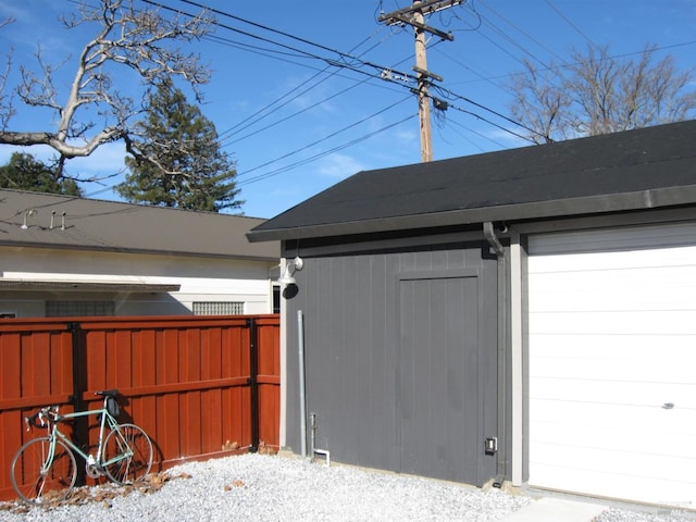 exterior space with a garage and an outdoor structure