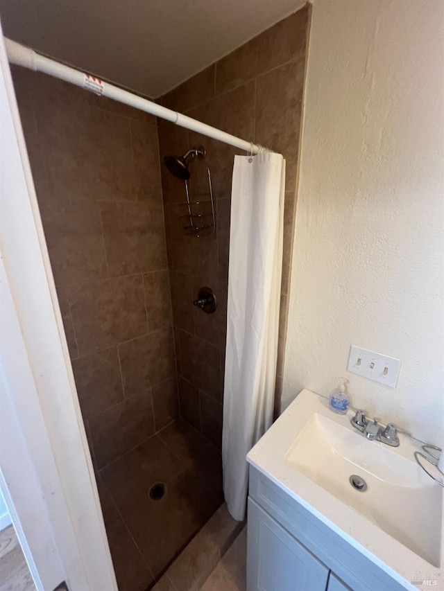 bathroom with vanity and a shower with shower curtain