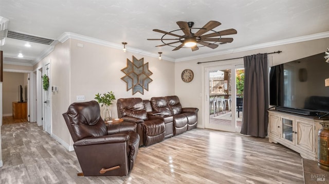 living room featuring ceiling fan, ornamental molding, and hardwood / wood-style floors