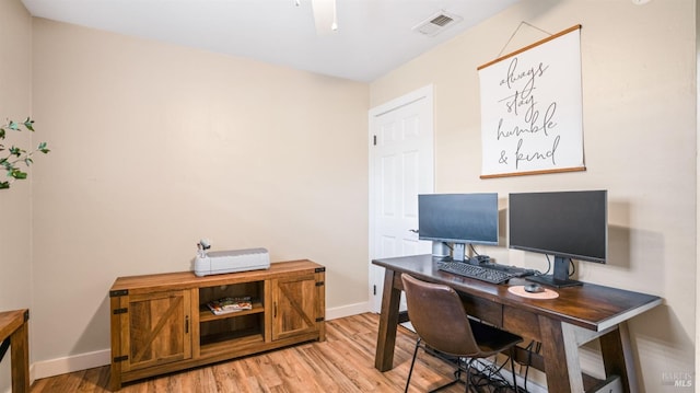 office space with light wood-type flooring