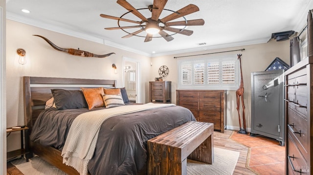 bedroom with connected bathroom, ceiling fan, and ornamental molding