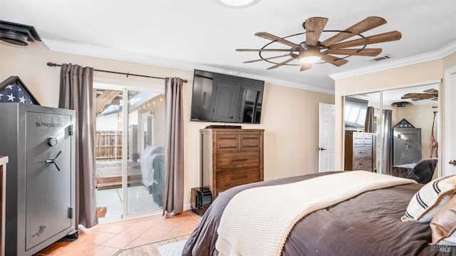 tiled bedroom featuring ceiling fan, ornamental molding, and access to outside