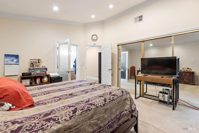 bedroom with light carpet, a closet, and ornamental molding