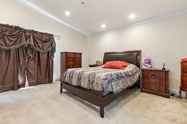 carpeted bedroom with vaulted ceiling