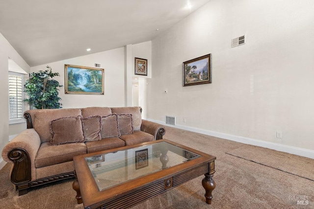 carpeted living room featuring vaulted ceiling