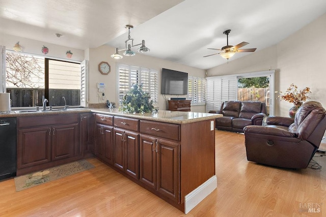 kitchen with ceiling fan, sink, dishwasher, kitchen peninsula, and light wood-type flooring