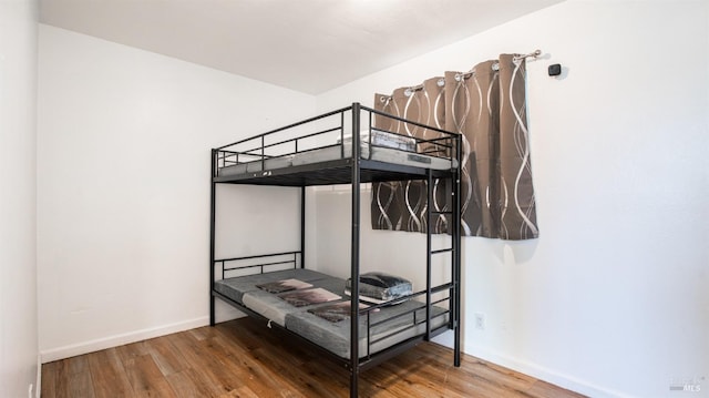 bedroom with hardwood / wood-style flooring