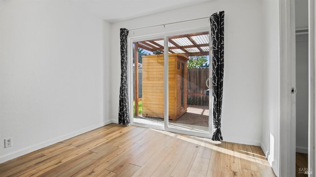 spare room featuring light hardwood / wood-style flooring