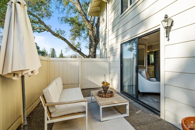 view of patio / terrace featuring fence