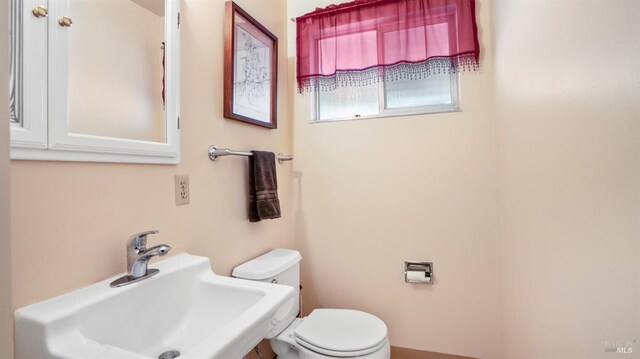 bathroom with toilet and sink