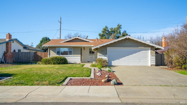 ranch-style home featuring a front yard and a garage