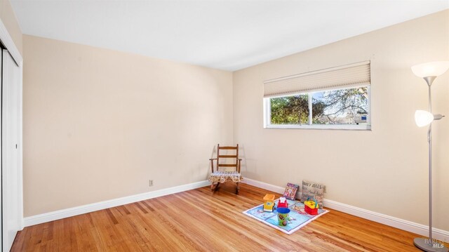 game room featuring light wood-type flooring