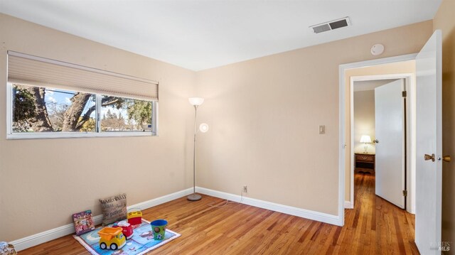 spare room with light hardwood / wood-style floors