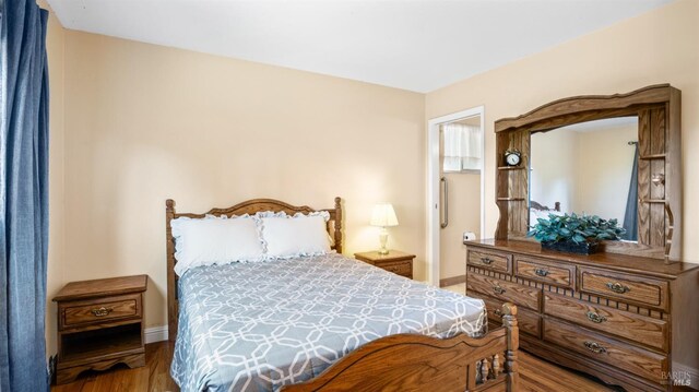 bedroom featuring wood-type flooring