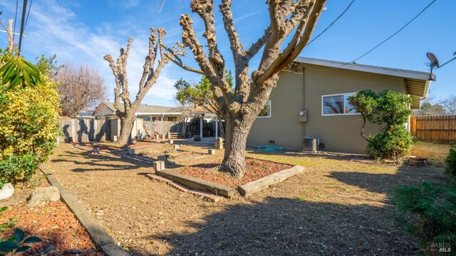 rear view of property with cooling unit