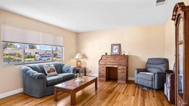 living room with light hardwood / wood-style floors