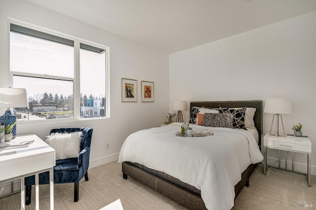 bedroom with light carpet