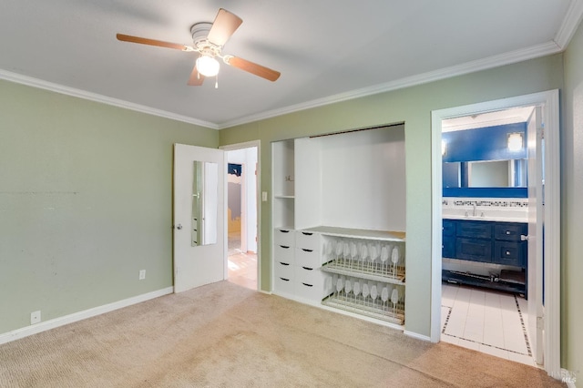 unfurnished bedroom with ornamental molding, a closet, and carpet flooring