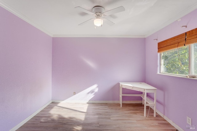 unfurnished bedroom featuring ornamental molding, baseboards, and wood finished floors