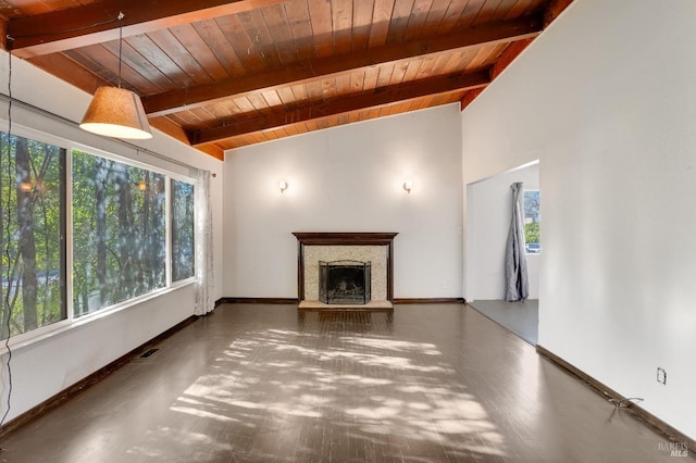 unfurnished living room with visible vents, a fireplace with raised hearth, lofted ceiling with beams, wood ceiling, and baseboards