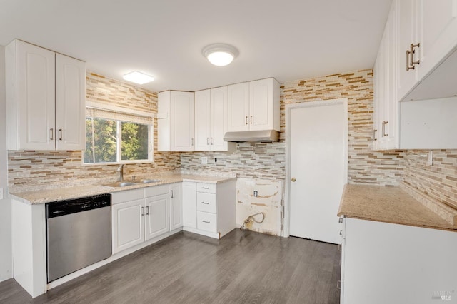 kitchen with decorative backsplash, dishwasher, dark wood-style floors, under cabinet range hood, and a sink