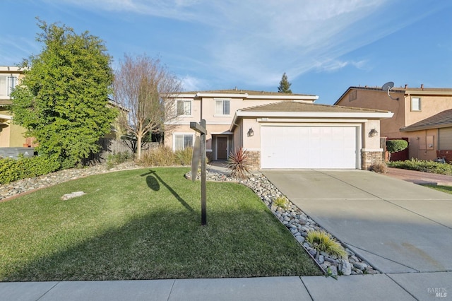 view of front facade with a garage and a front lawn