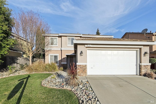 view of front of property with stucco siding, fence, a garage, stone siding, and driveway