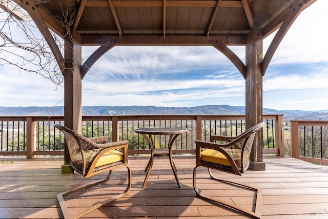 wooden terrace featuring a gazebo and a mountain view