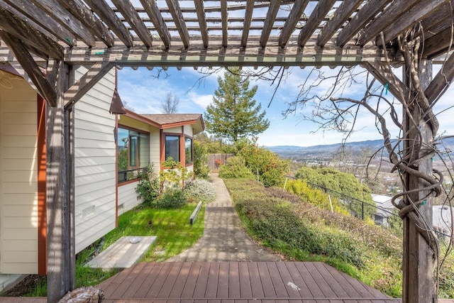 view of yard with a mountain view and a pergola