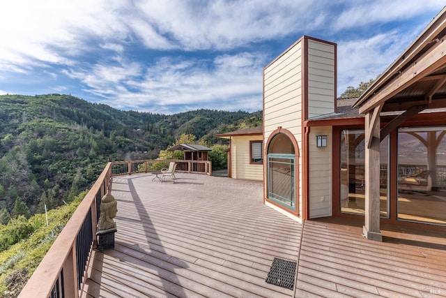 wooden terrace featuring a mountain view