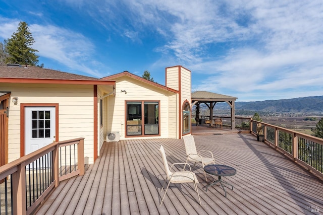 deck with a mountain view and a gazebo