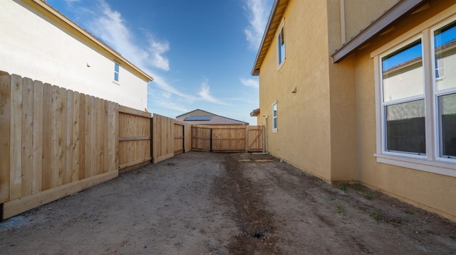 exterior space featuring fence and a gate